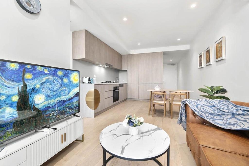 a living room with a large flat screen tv at The amazing 1BR CBD Apt Premium Location in Adelaide