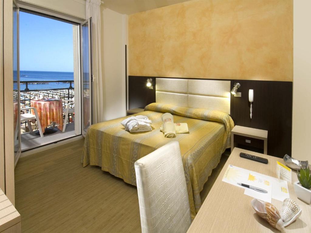 Postel nebo postele na pokoji v ubytování Hotel Alba