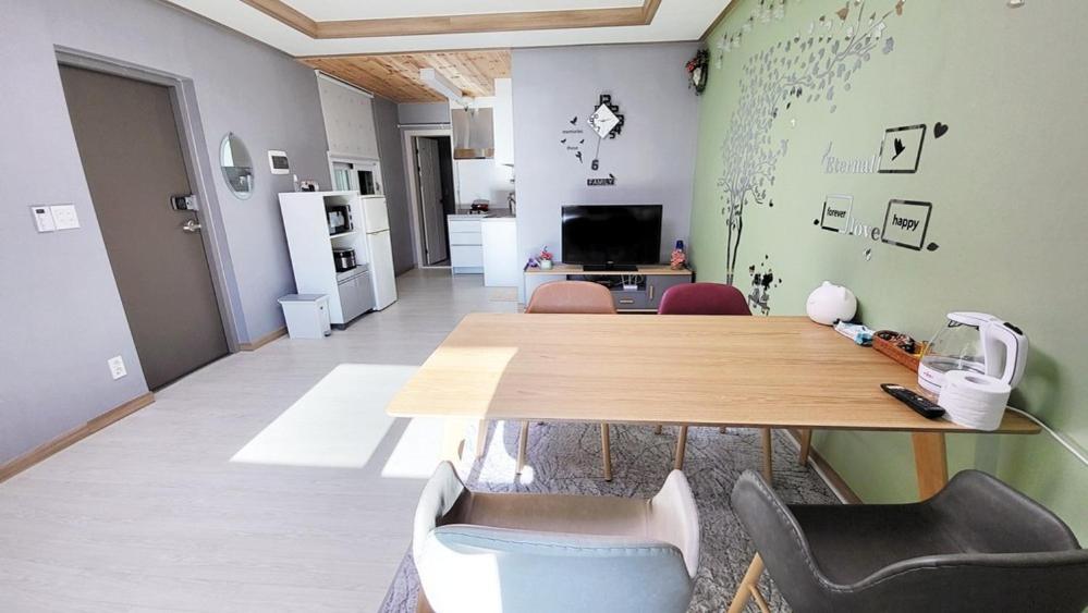 a room with a table and chairs in a room at Goseong Deulggot Stay Private House in Goseong