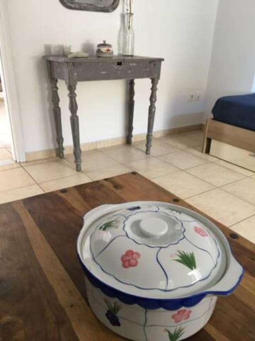 a dog bowl sitting on the floor in a room at Marditsa's House by the sea in Serifos Chora