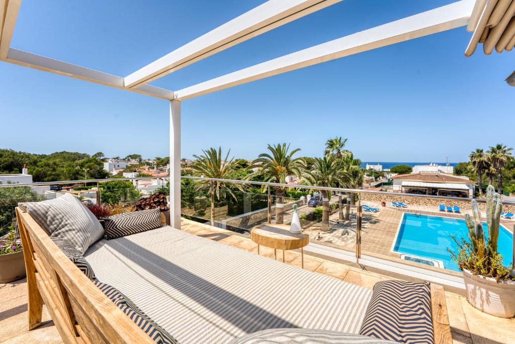 a balcony with a view of a swimming pool at APARTAMENTO SA PERDIU N 29 in Son Carrio