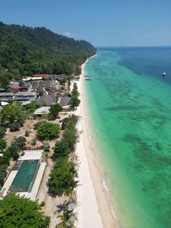 an aerial view of the beach and ocean at Thanya Beach Resort - SHA Plus in Ko Ngai