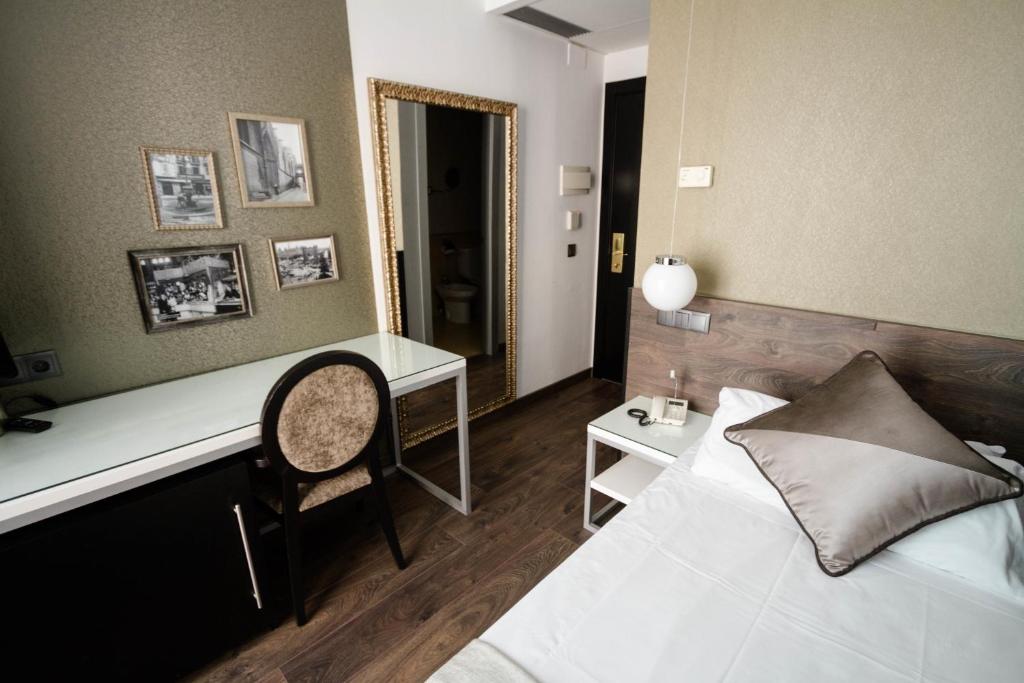 Posteľ alebo postele v izbe v ubytovaní Moderno