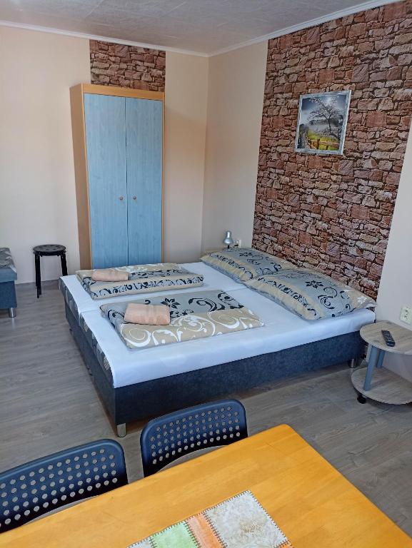 Postel nebo postele na pokoji v ubytování Abturist penzion