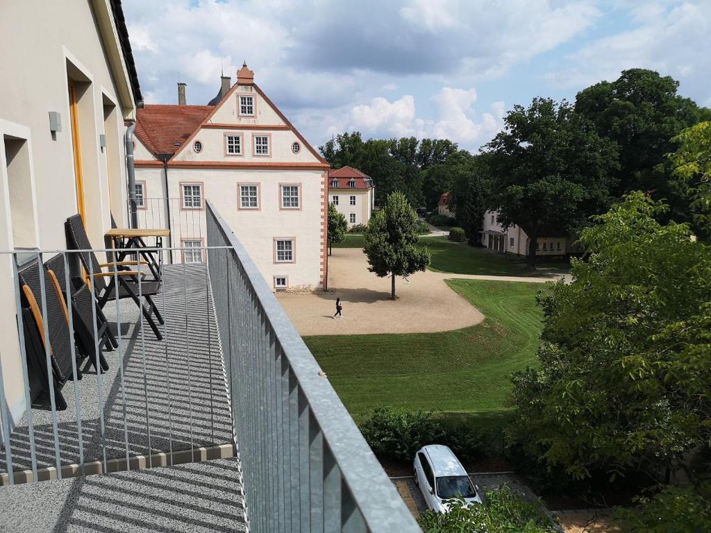 a view of a house from a balcony at Ferienwohnungen in der Wassermühle am Schloss in Königs Wusterhausen