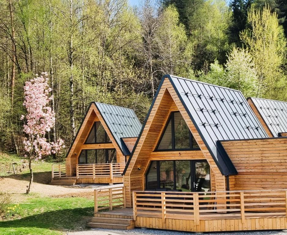 a log cabin with a solar roof at Mountains & Lakes - Chaletdorf in Villach