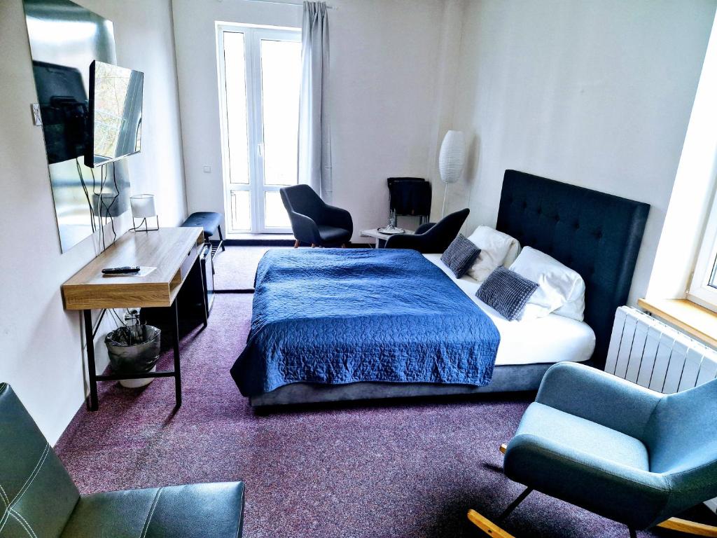 Postel nebo postele na pokoji v ubytování Family hotel Maxim