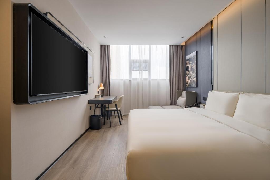 Postel nebo postele na pokoji v ubytování Atour Hotel Xiamen North Station Jiageng Stadium