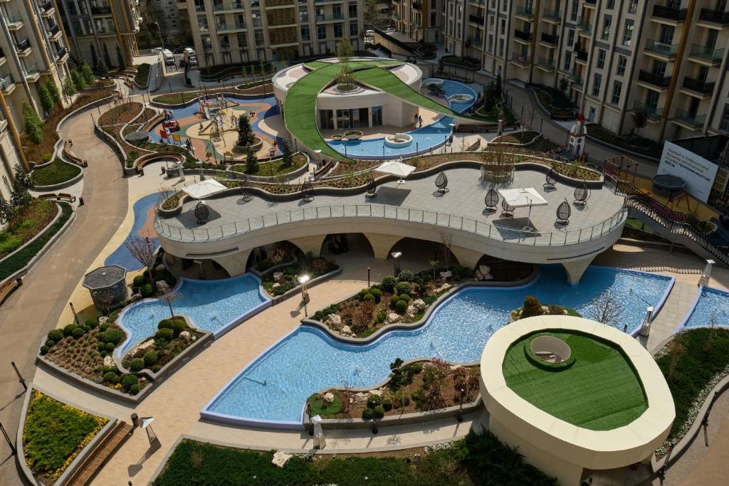 an aerial view of a water park in a building at STYLO Residences & Suites in Tashkent