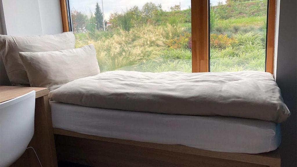 Postel nebo postele na pokoji v ubytování Avaneo Hotel Marktredwitz