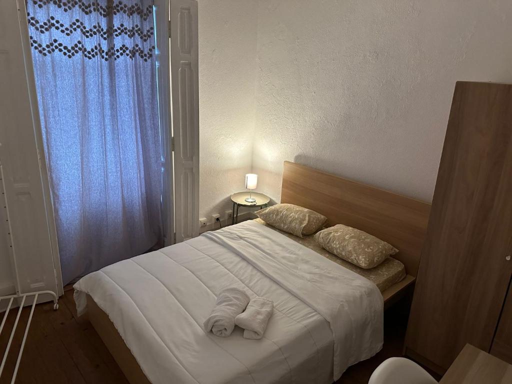 Кровать или кровати в номере Palmela Castle Rooms