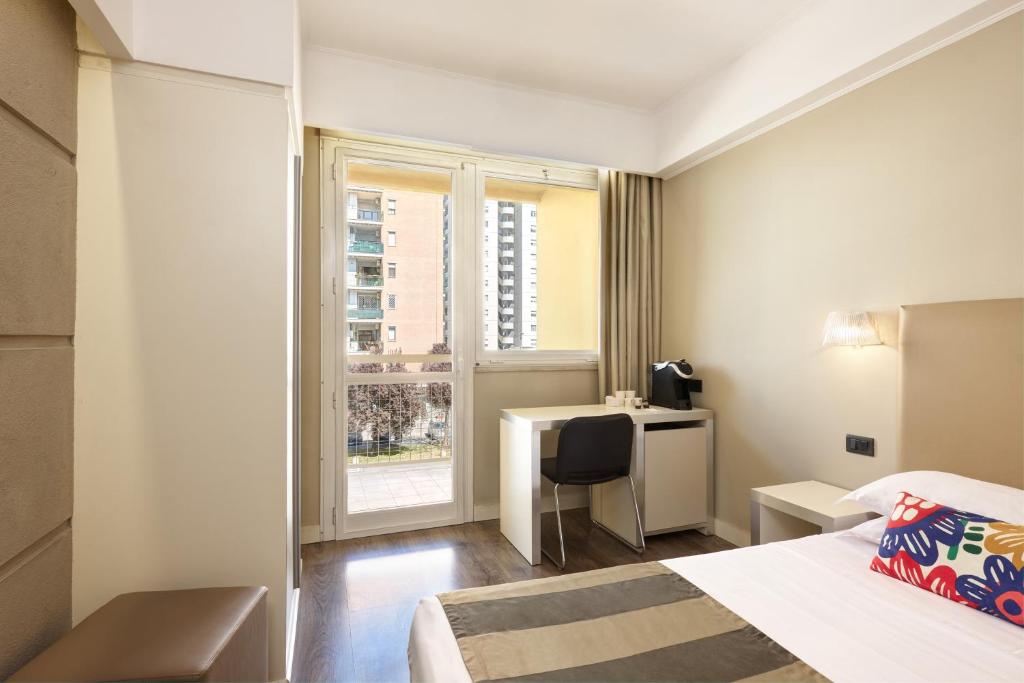 Cama o camas de una habitación en Hotel Roma Tor Vergata