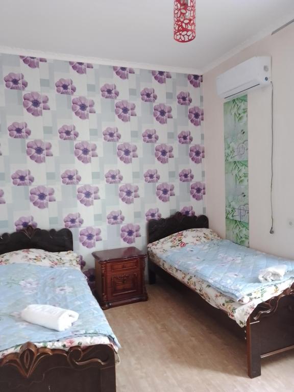 Postel nebo postele na pokoji v ubytování Tamuna Guest House