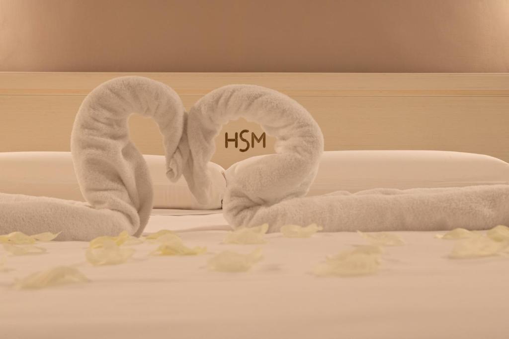 Postel nebo postele na pokoji v ubytování Hotel Santa Maura