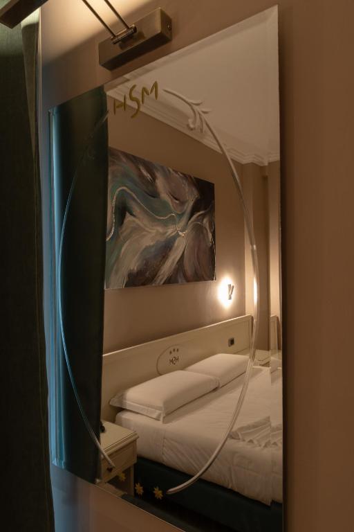 Postel nebo postele na pokoji v ubytování Hotel Santa Maura