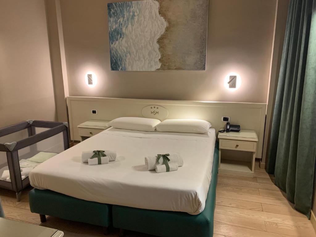Postel nebo postele na pokoji v ubytování Hotel Santa Maura
