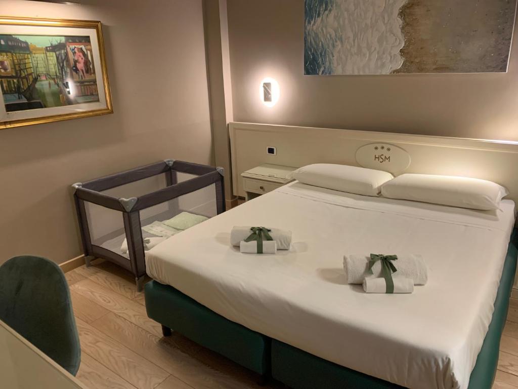 Postel nebo postele na pokoji v ubytování Hotel Santa Maura