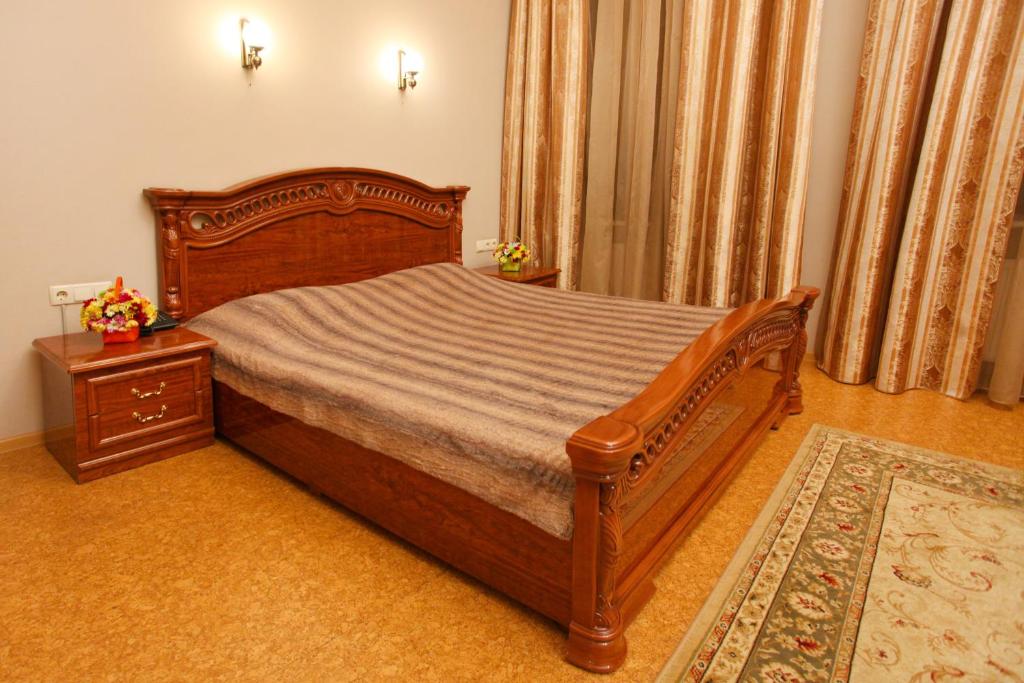 Postel nebo postele na pokoji v ubytování Ekaterina Hotel