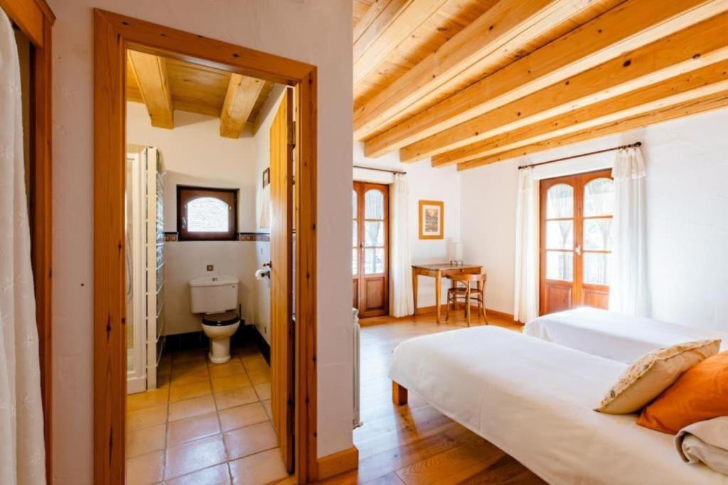 Postel nebo postele na pokoji v ubytování Casa Tadeguaz