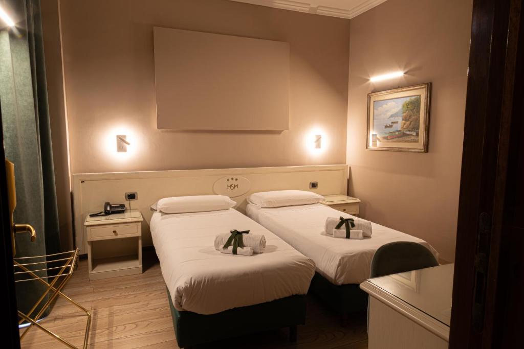 Postel nebo postele na pokoji v ubytování Hotel Santa Maura