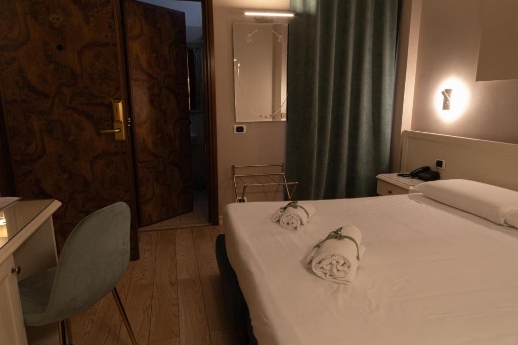 Postel nebo postele na pokoji v ubytování Hotel Santa Maura
