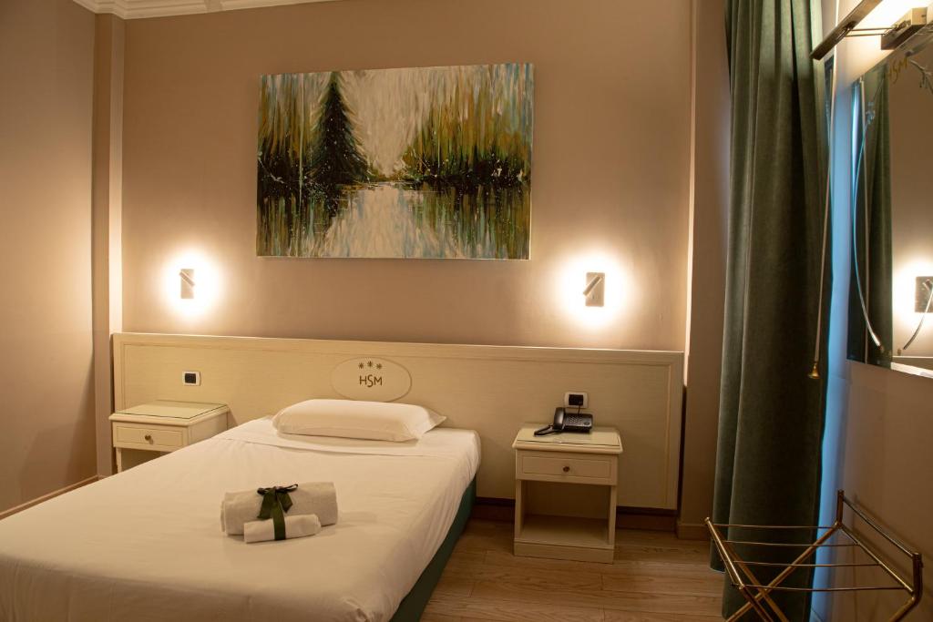 Postel nebo postele na pokoji v ubytování Hotel Santa Maura