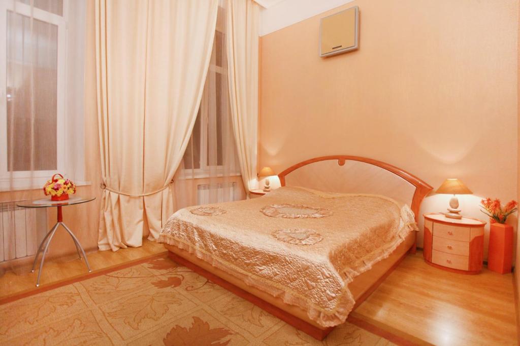 Postel nebo postele na pokoji v ubytování Ekaterina Hotel