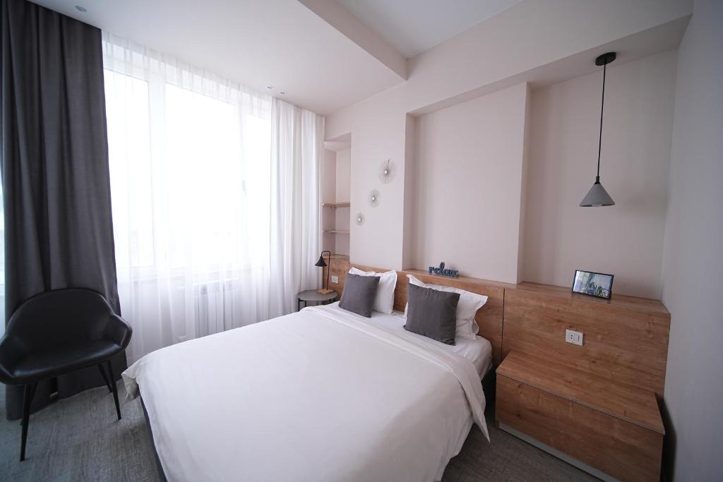 Postel nebo postele na pokoji v ubytování Sweet Home Apart-Hotel