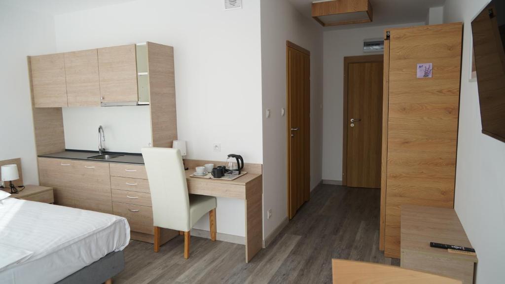 Kuchyň nebo kuchyňský kout v ubytování Apartament Aparthotel Passage