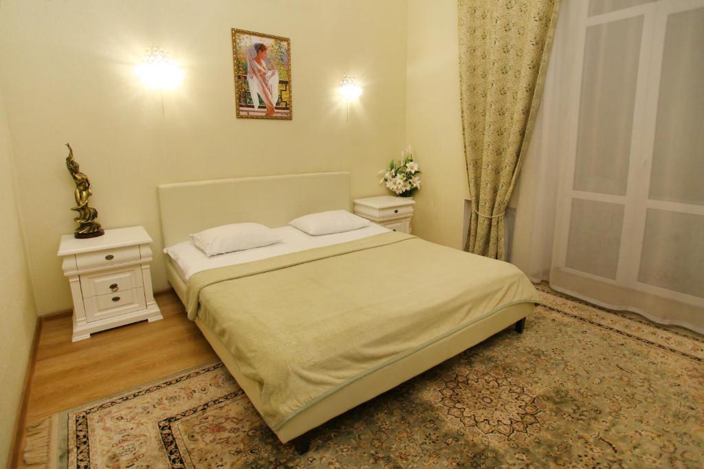 Postel nebo postele na pokoji v ubytování Ekaterina Hotel