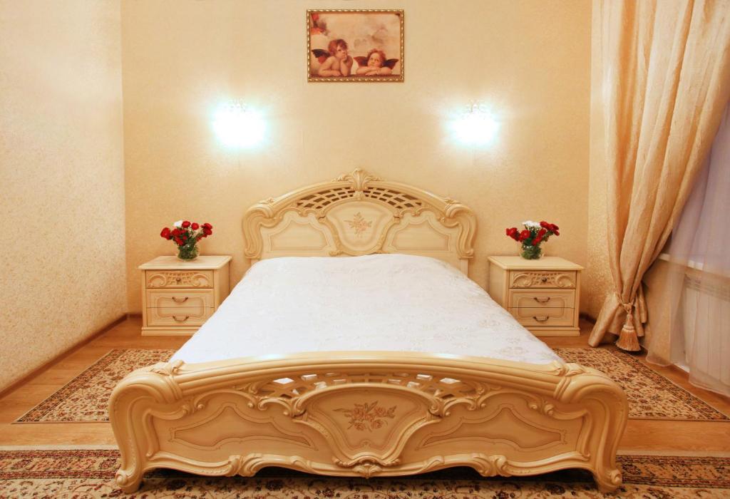 Postel nebo postele na pokoji v ubytování Ekaterina Hotel