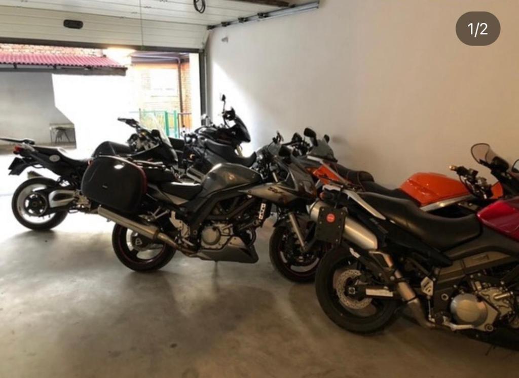 a group of motorcycles parked in a garage at Villa Sky in Sarajevo