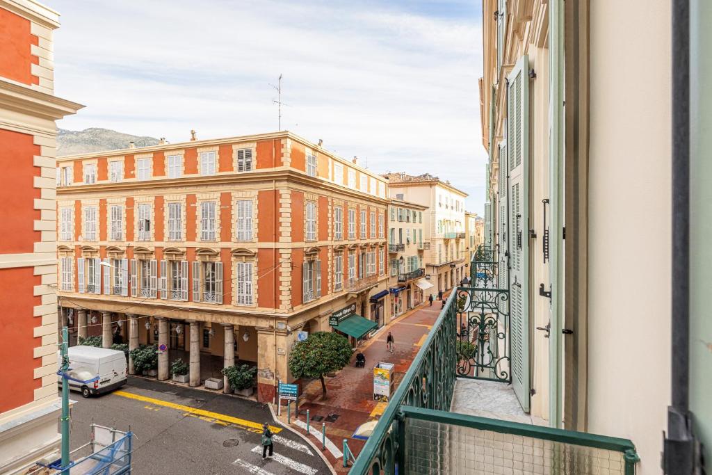 a view of a city street from a balcony at Regina - Happy Rentals in Menton