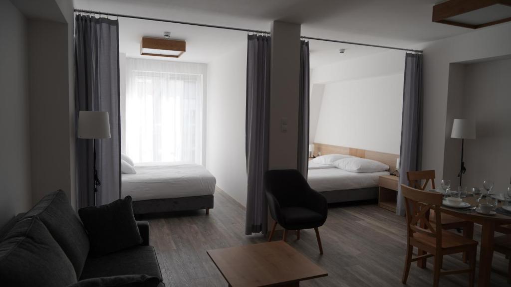 Postel nebo postele na pokoji v ubytování Apartament Aparthotel Passage