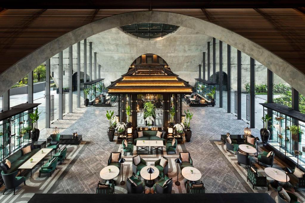 an overhead view of a restaurant with tables and chairs at Sindhorn Kempinski Hotel Bangkok in Bangkok