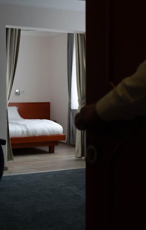 Postel nebo postele na pokoji v ubytování Hotel Bosna 1