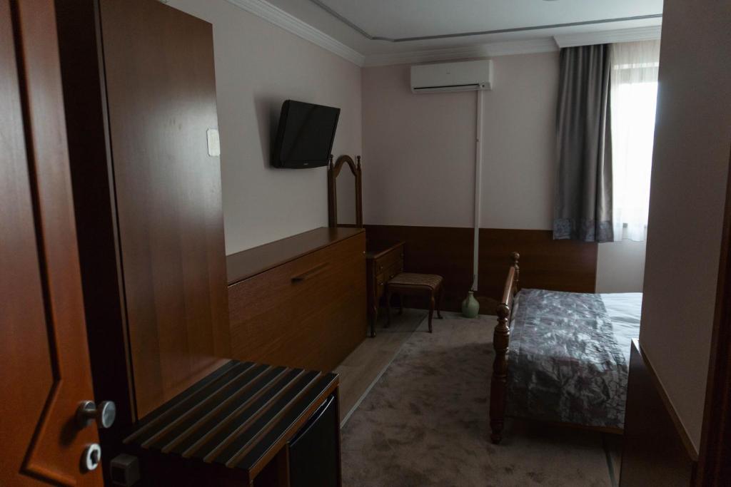 Postel nebo postele na pokoji v ubytování Hotel Bosna 1