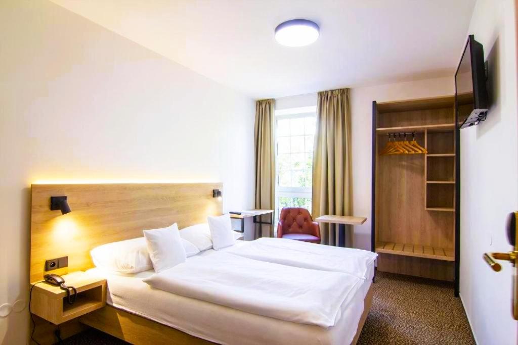 Postel nebo postele na pokoji v ubytování Hotel Avion