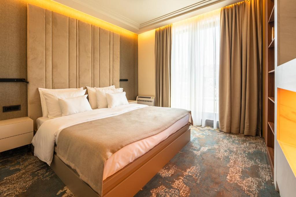 Ένα ή περισσότερα κρεβάτια σε δωμάτιο στο Hotel Kocka Vrnjačka Banja