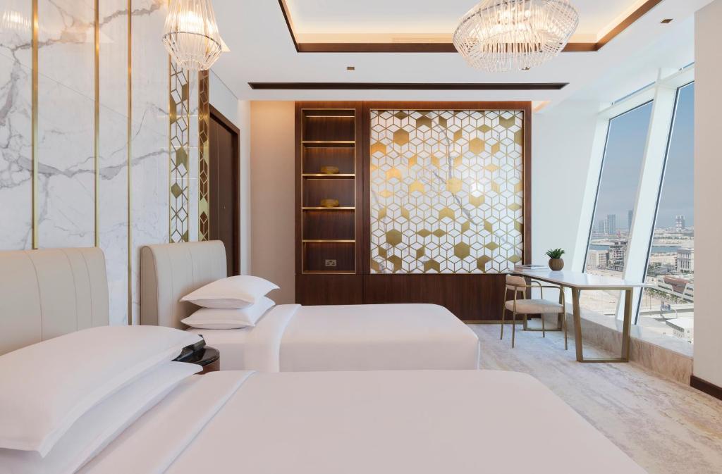 Postelja oz. postelje v sobi nastanitve Velero Hotel Doha Lusail
