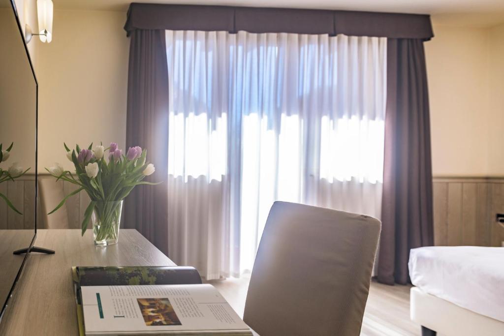 Postel nebo postele na pokoji v ubytování Hotel Golf Inn