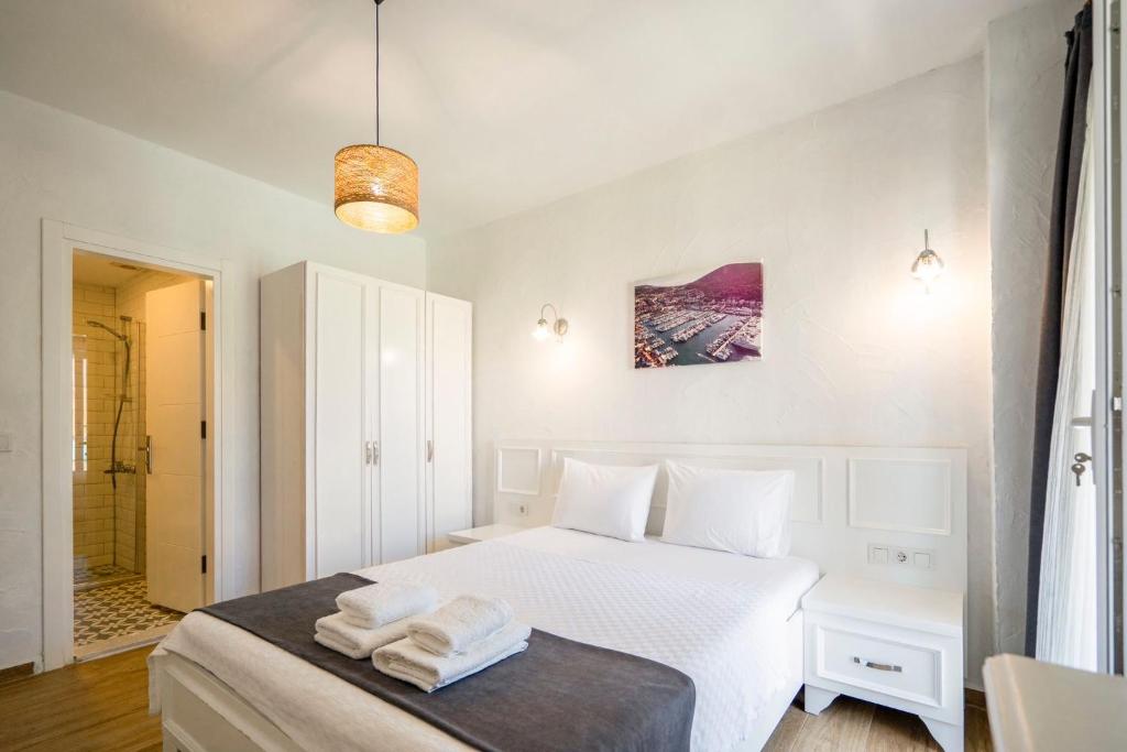 Postel nebo postele na pokoji v ubytování LONDİA OTEL