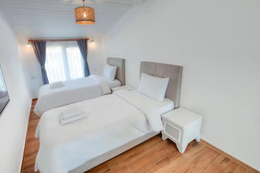 Postel nebo postele na pokoji v ubytování LONDİA OTEL
