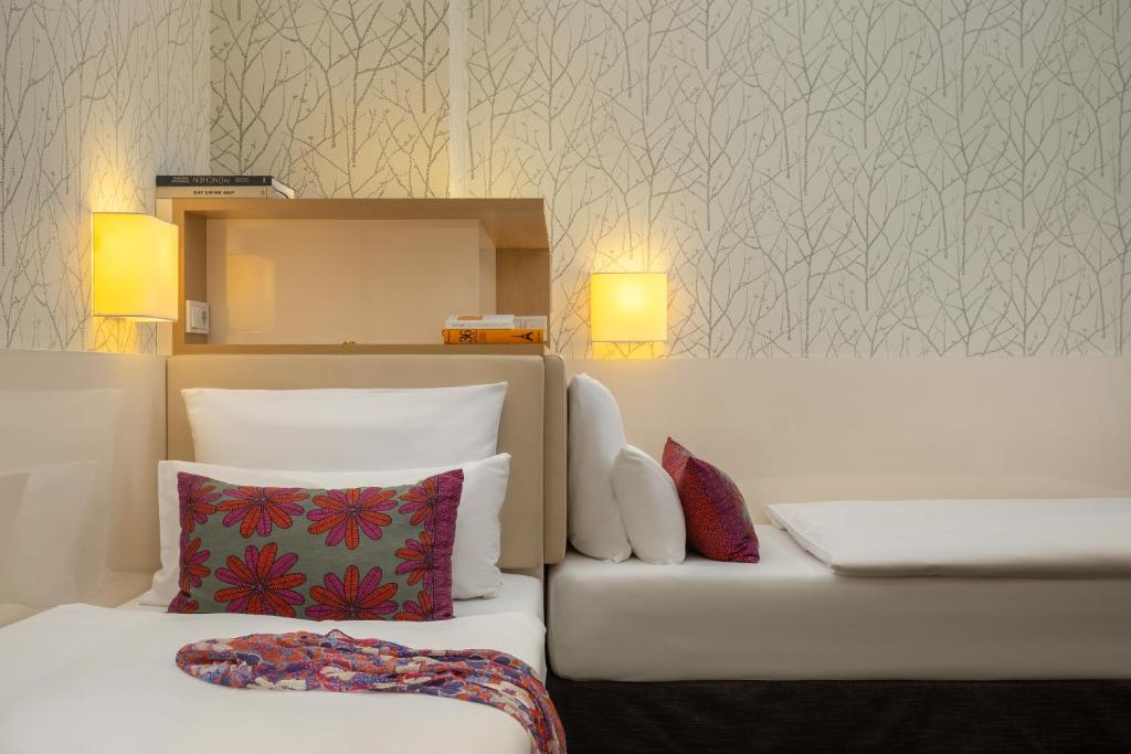 Postel nebo postele na pokoji v ubytování Boutique Hotel Atrium München