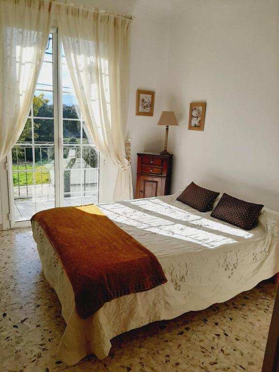 En eller flere senge i et værelse på Villa proche de la mer