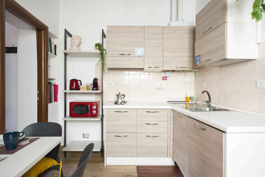 A kitchen or kitchenette at URBANA 37 Maison