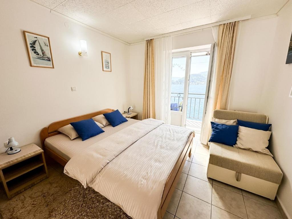 Postel nebo postele na pokoji v ubytování Apartments Okuka