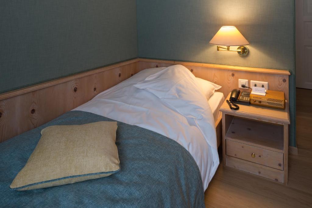Letto o letti in una camera di Hotel Post