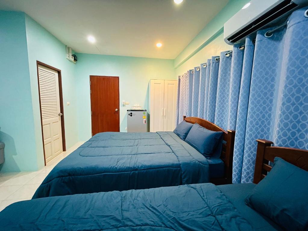 Postel nebo postele na pokoji v ubytování NUN GUEST HOUSE