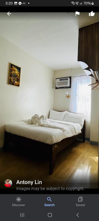 Postel nebo postele na pokoji v ubytování BELLADAMA HOTEL